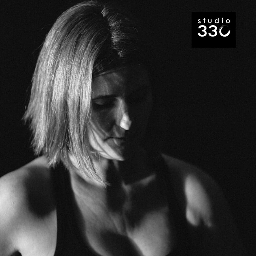 Black and White head shot of Gill looking slightly downward