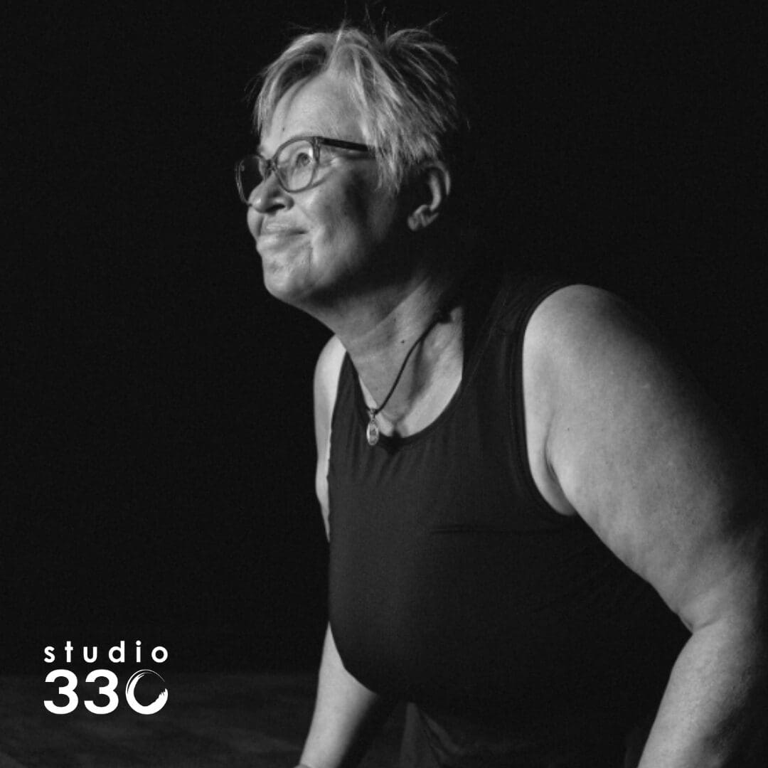 Black and White side profile of Karin doing upward dog